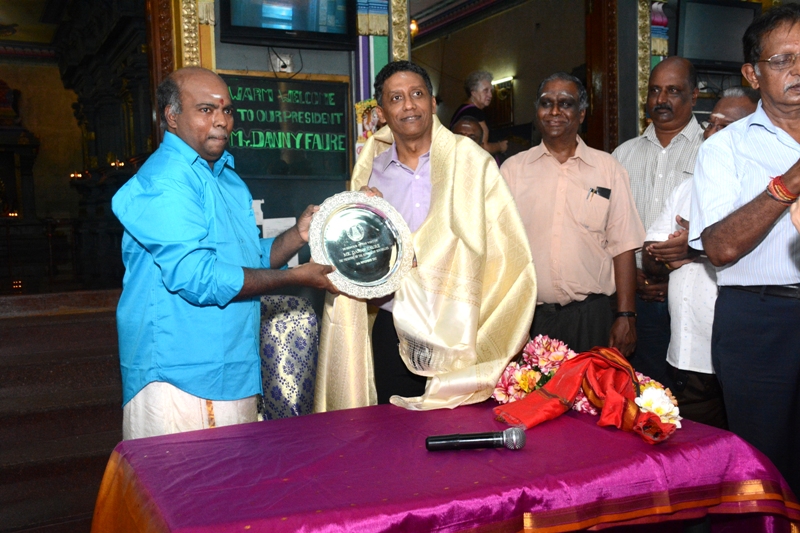 8. SHKS chairman presenting a memento to President Danny Faure in the temple